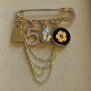 Elegant Gold Charm Brooch
